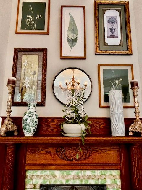 Fireplace mantel and botanical artwork
